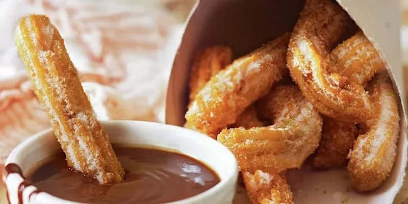 https://expanish-web-images.s3.us-east-2.amazonaws.com/bcn_churros_con_chocolate_2b3ab30196.webp
