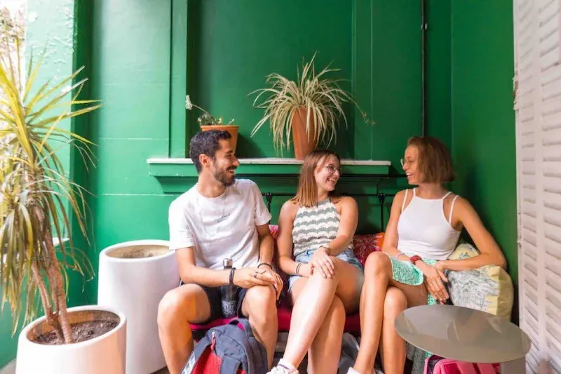 Adult students at Expanish Buenos Aires relaxing and chatting in the school common area.