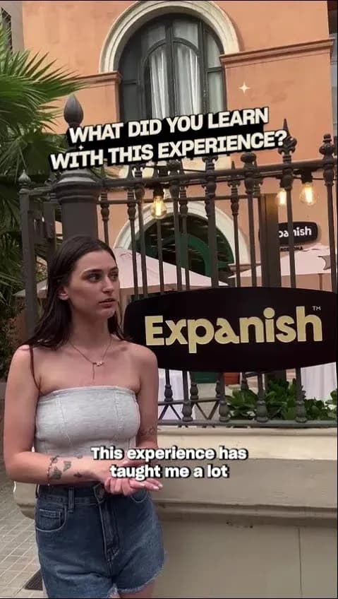 Student giving testimonial outside Expanish Barcelona school building