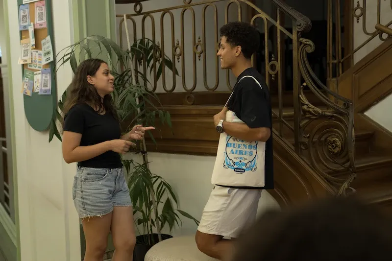 Two students talking together inside Expanish Buenos Aires school