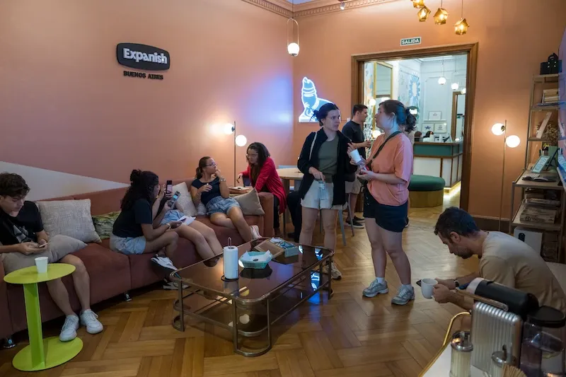 Students relaxing and socializing in a lounge area at Expanish Buenos Aires