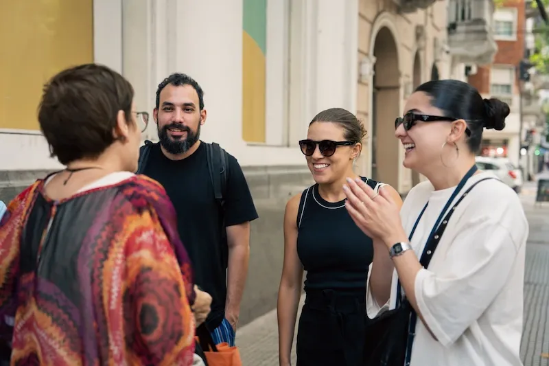 Students talking and laughing together outside in Buenos Aires
