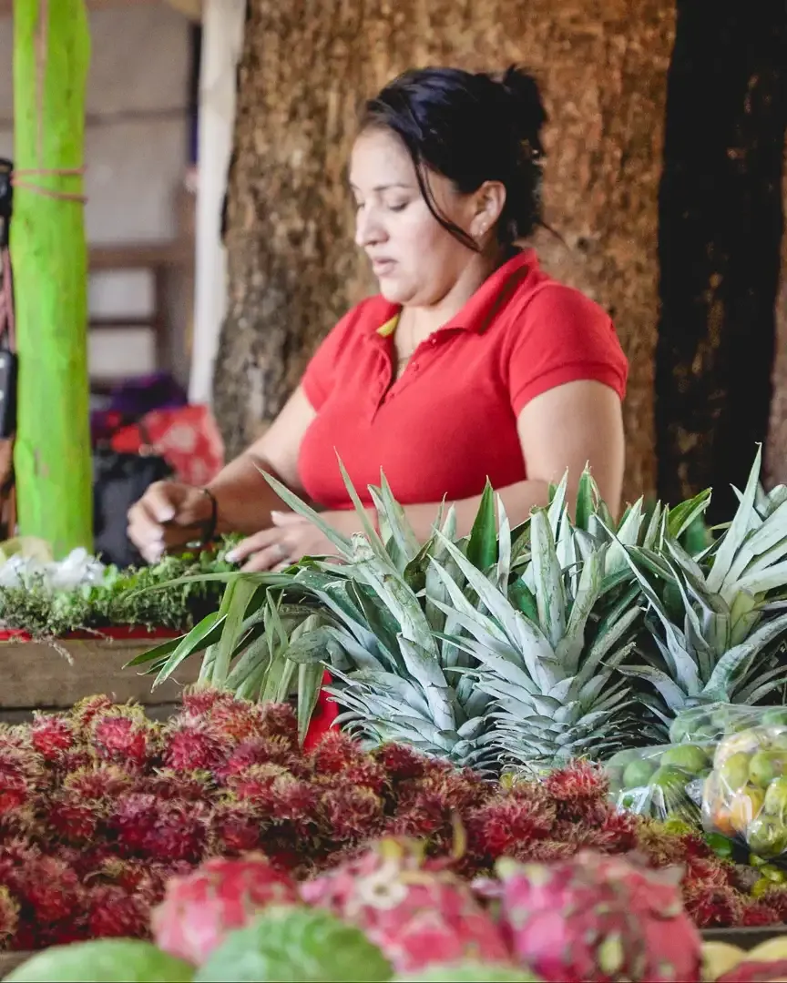 Local vendor preparing fresh fruits at a market in Samara Costa Rica