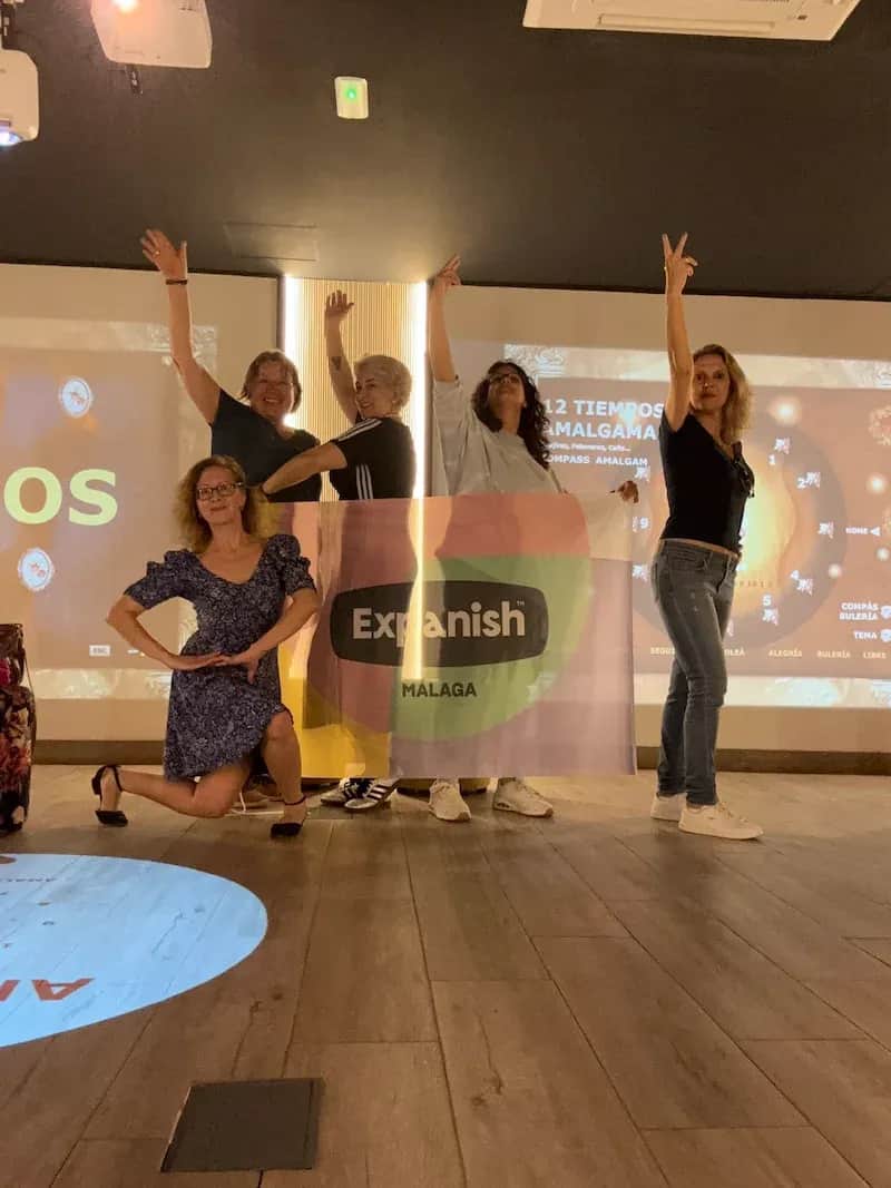 50+ Program students posing during a lively flamenco class at the Expanish Málaga center.