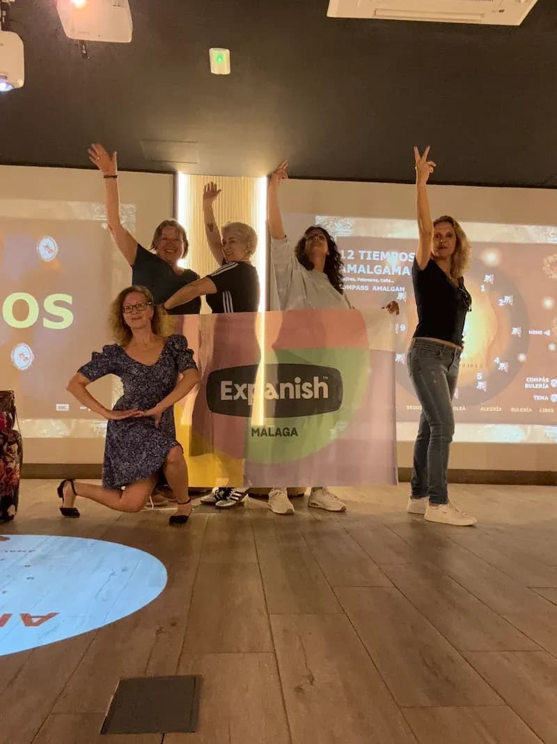 50+ Program students posing during a lively flamenco class at the Expanish Málaga center.