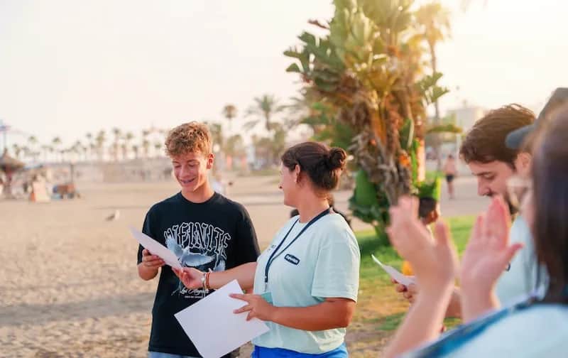 Expanish student and staff member participating in an outdoor activity on Málaga’s beach.