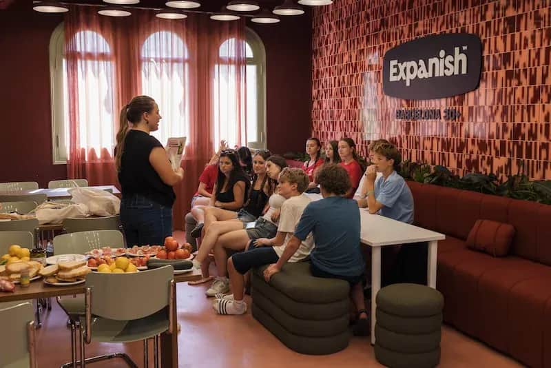 Expanish Barcelona summer camp students attending a workshop at the school with snacks prepared.